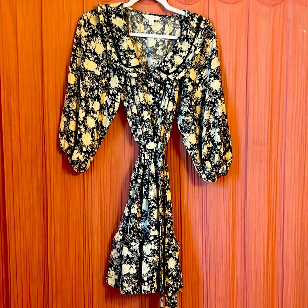 Lauren Conrad small dress with puffed sleeves and ruffle at bottom.